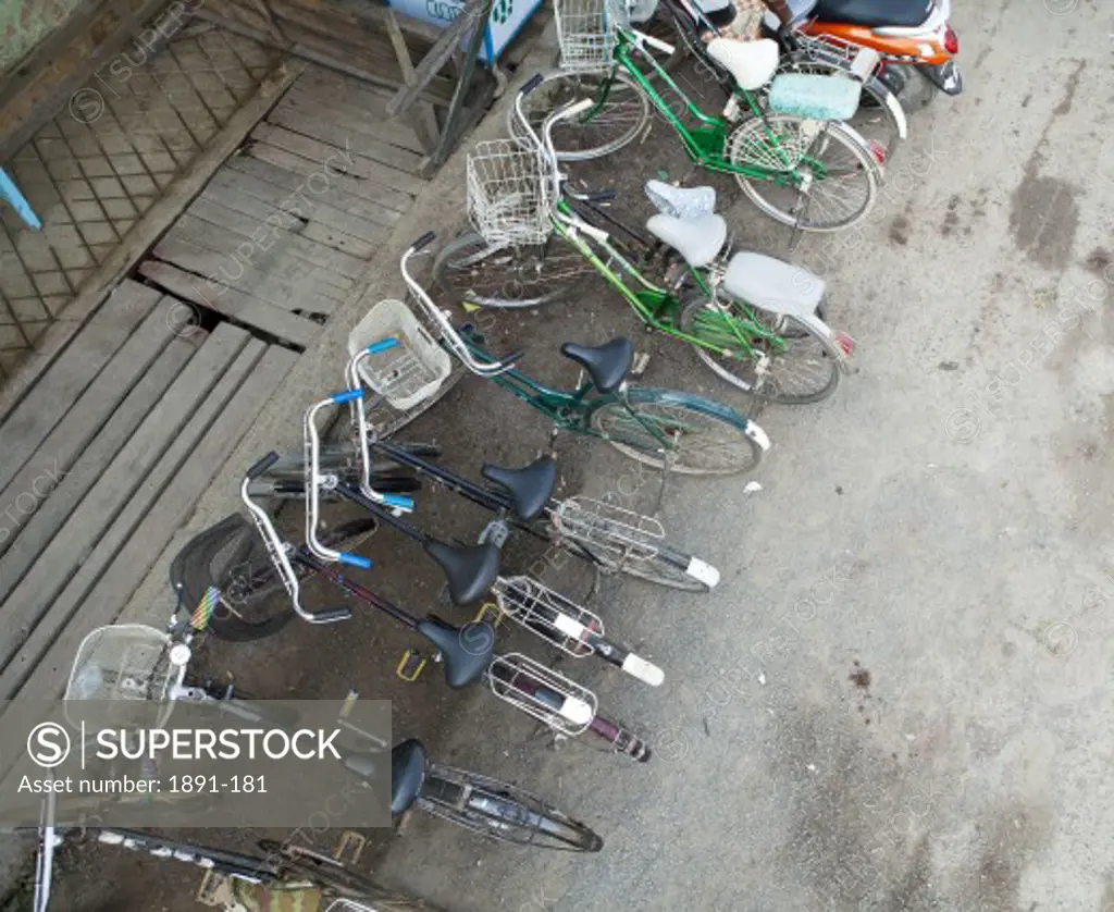 High angle view of bicycles parked at the roadside, Myanmar