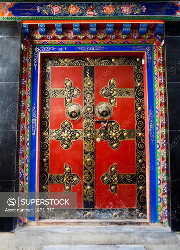 Ornate closed door of a palace, Potala Palace, Lhasa, Tibet,