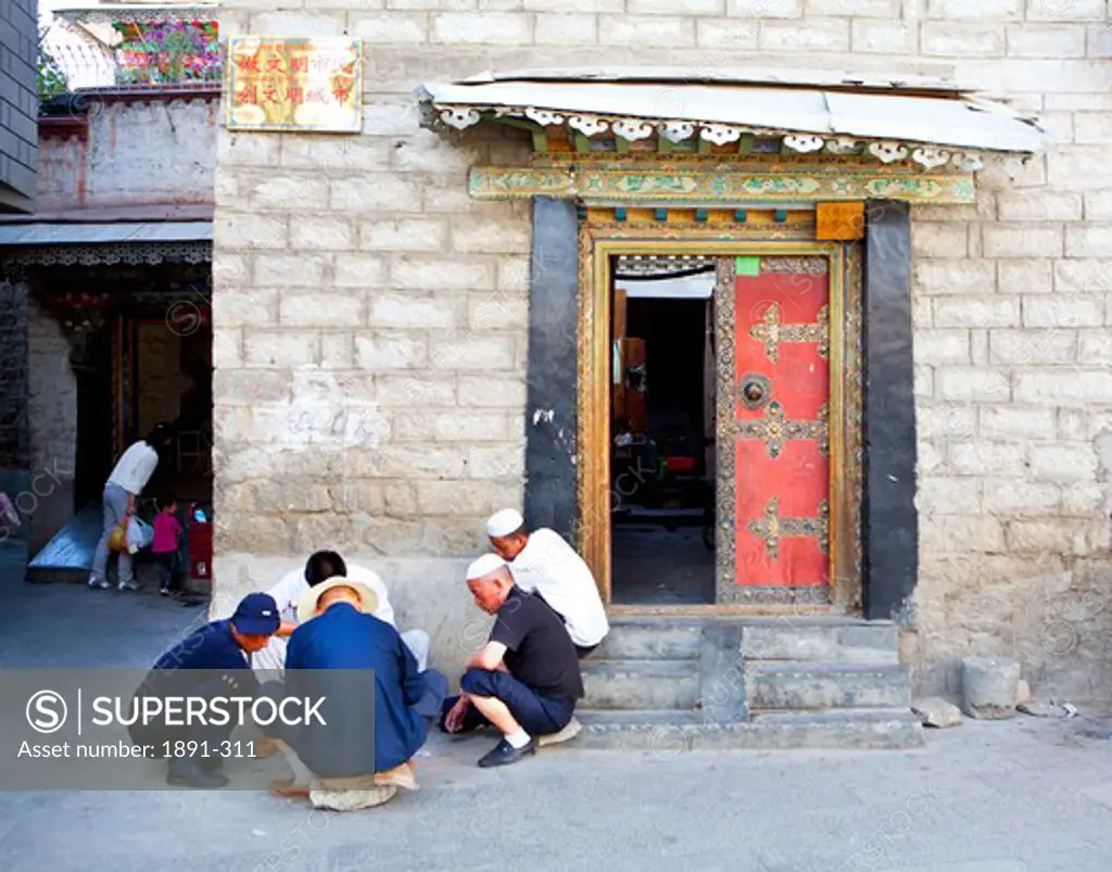 Muslim men gambling, Tibet,