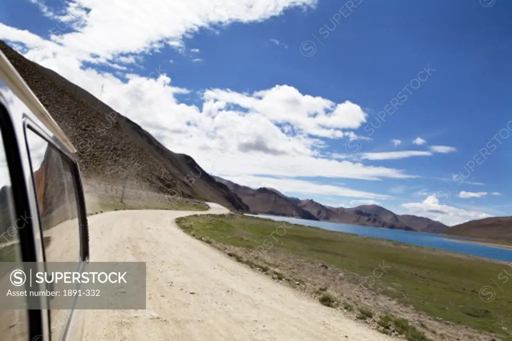 Car on a dirt road, Tibet,