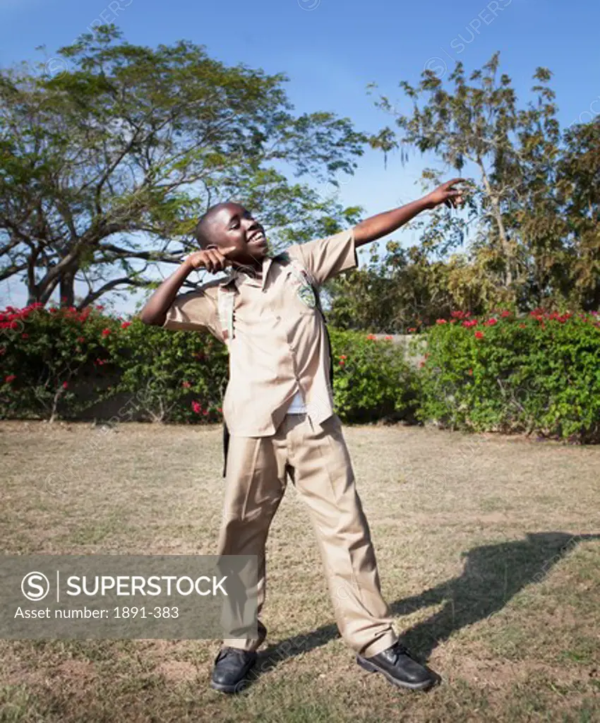 Schoolboy playing in a park, Jamaica