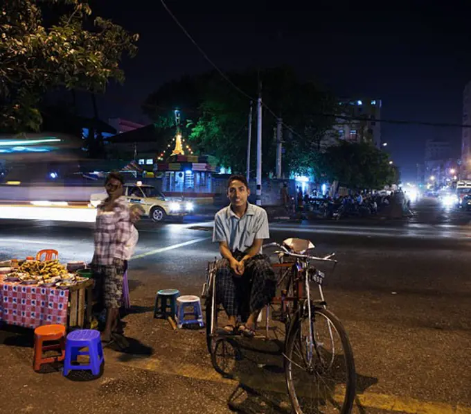 Man sitting on a pedicab, Yangon, Myanmar