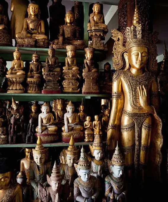 Hand crafted Buddha's statues in a market, Myanmar