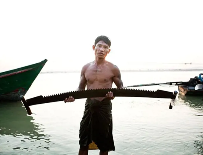 Man holding a saw, Myanmar