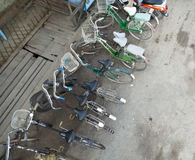 High angle view of bicycles parked at the roadside, Myanmar