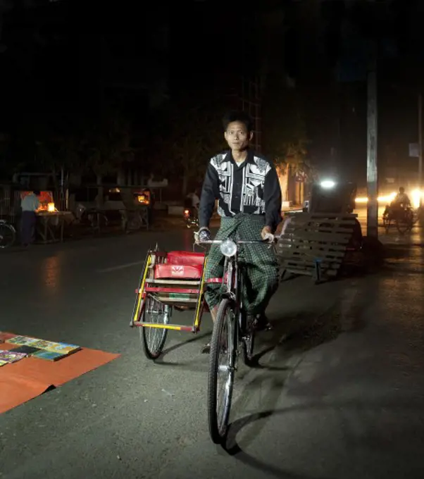 Man riding a pedicab, Myanmar