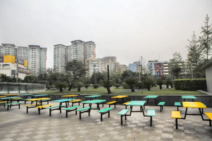 Table and bench at a sidewalk cafe, Chengdu, Sichuan Province, China