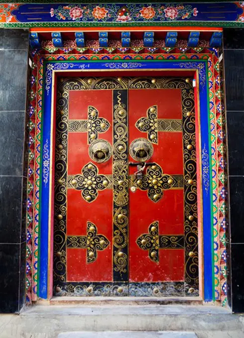 Ornate closed door of a palace, Potala Palace, Lhasa, Tibet,