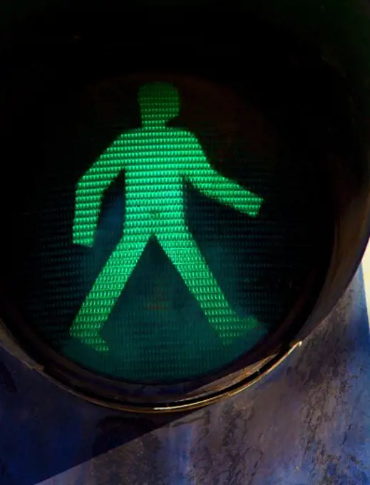 Close-up of a pedestrian crossing light signalling 'Walk' icon, Tibet,