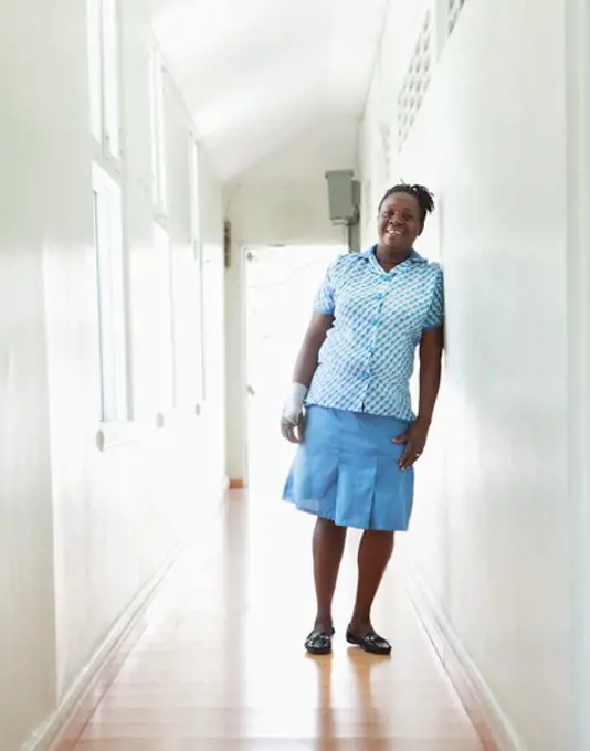 Hotel employee standing in the corridor of a hotel, Jamaica