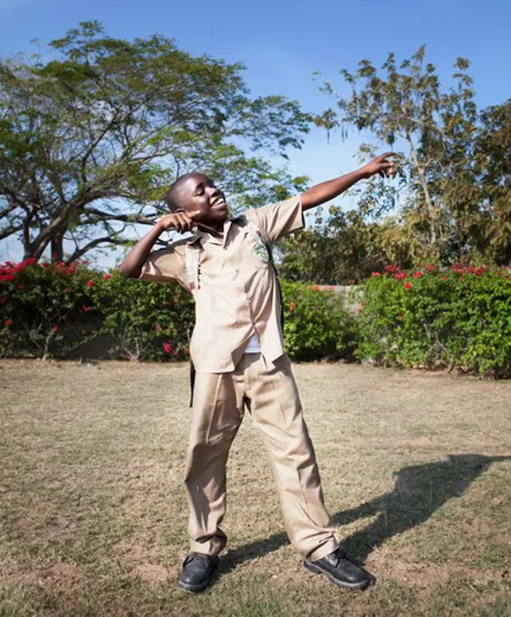 Schoolboy playing in a park, Jamaica