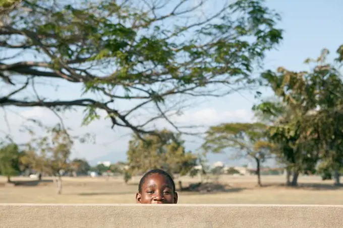 Schoolboy playing in a park, Jamaica