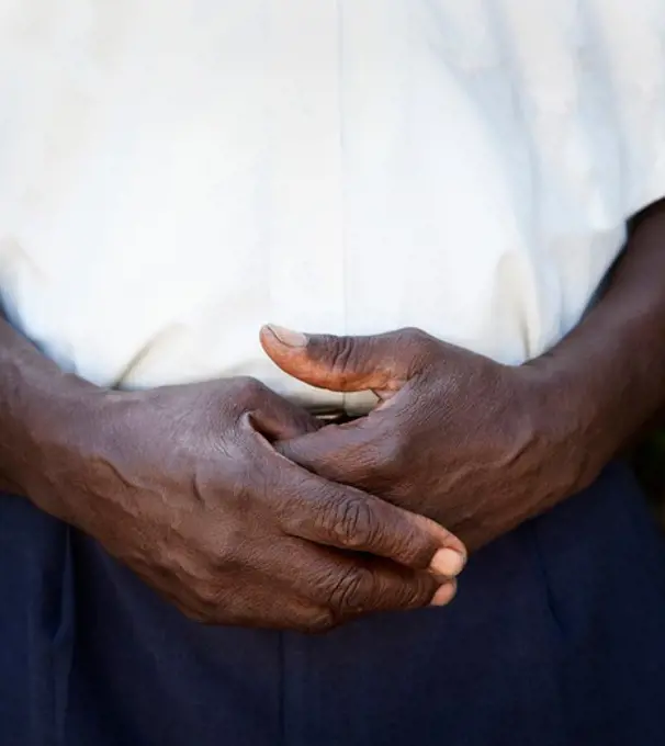 Close-up of a man standing with his hands clasped, Jamaica