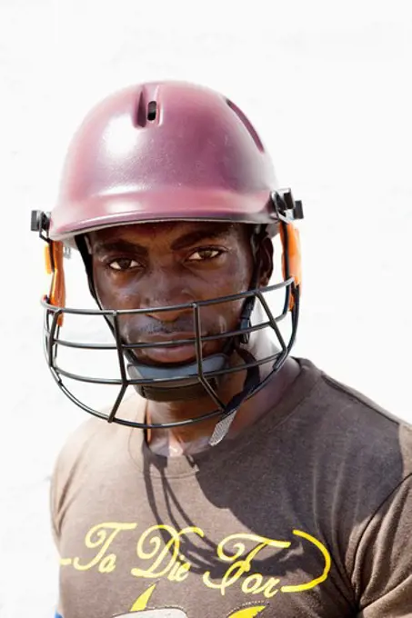 Close-up of a man wearing a cricket helmet, Jamaica