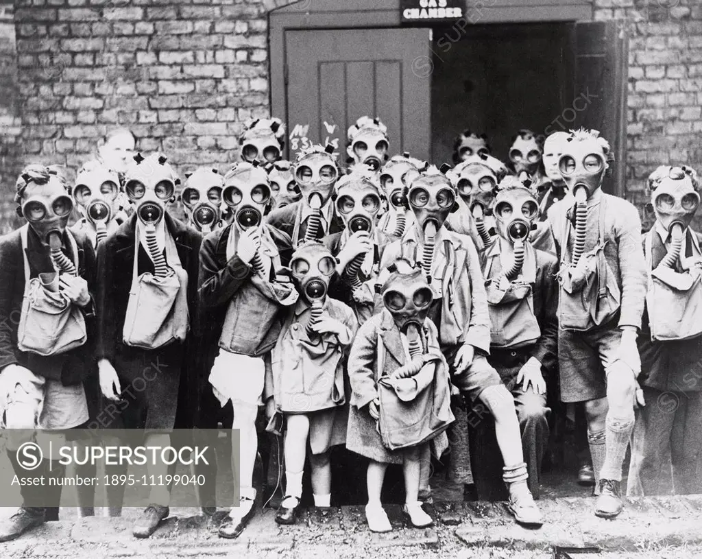 Children taking part in a gas exercse. World War Two: Civilian Life, Gas Masks. Daily Herald black and white photograph of children taking part in a g...