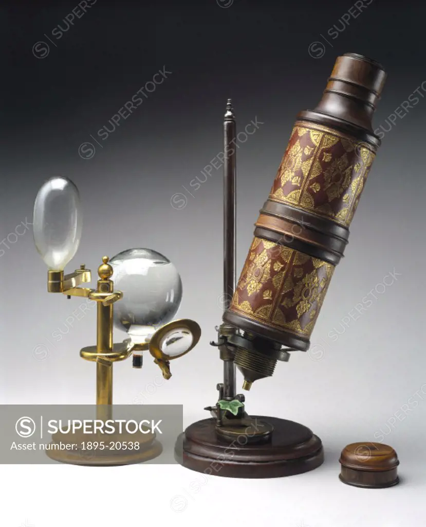 Microscope associated with Robert Hooke (1635-1703), shown with a copy of the illuminating system used. This microscope, among the scientific instrume...