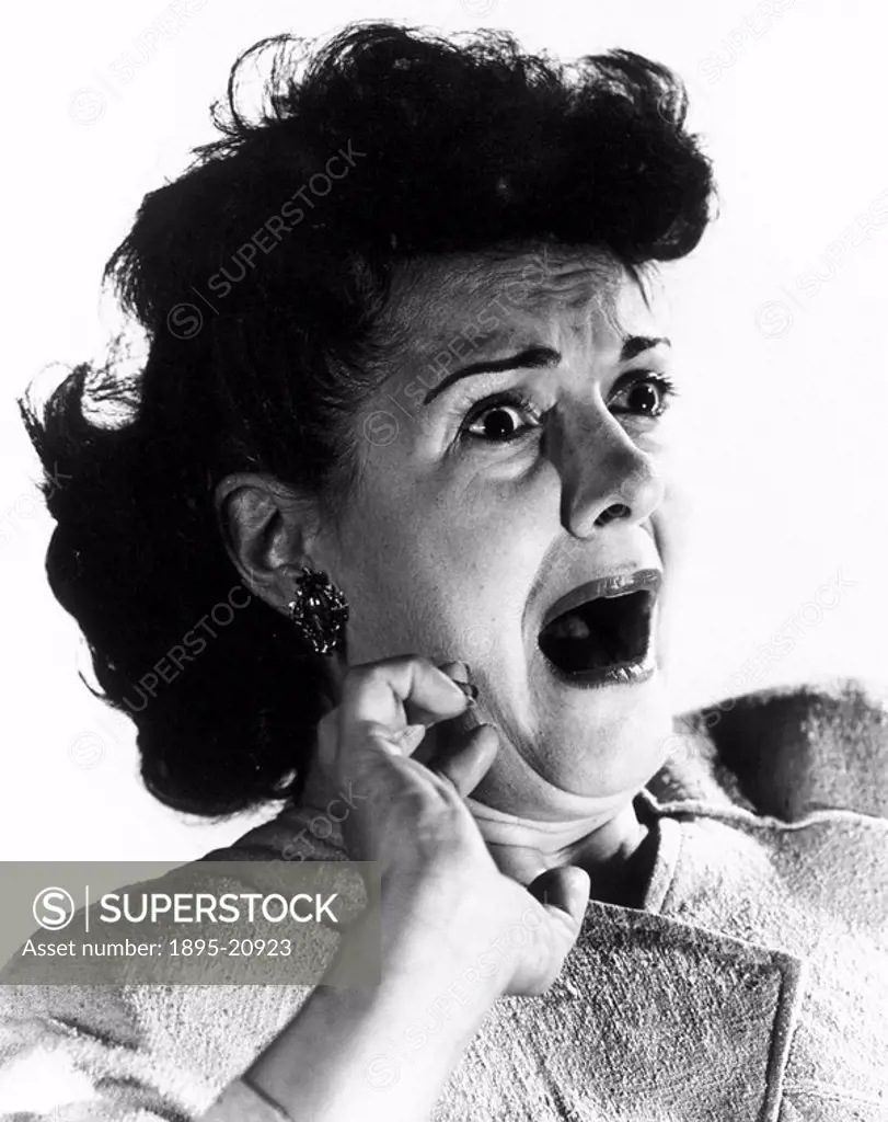 Woman gasping with terror, c 1940s.