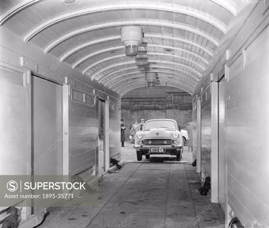 Car inside a container, owned by the Car sleeper company, 20 June 1955. This train transported both passengers and their cars, so that people could go...