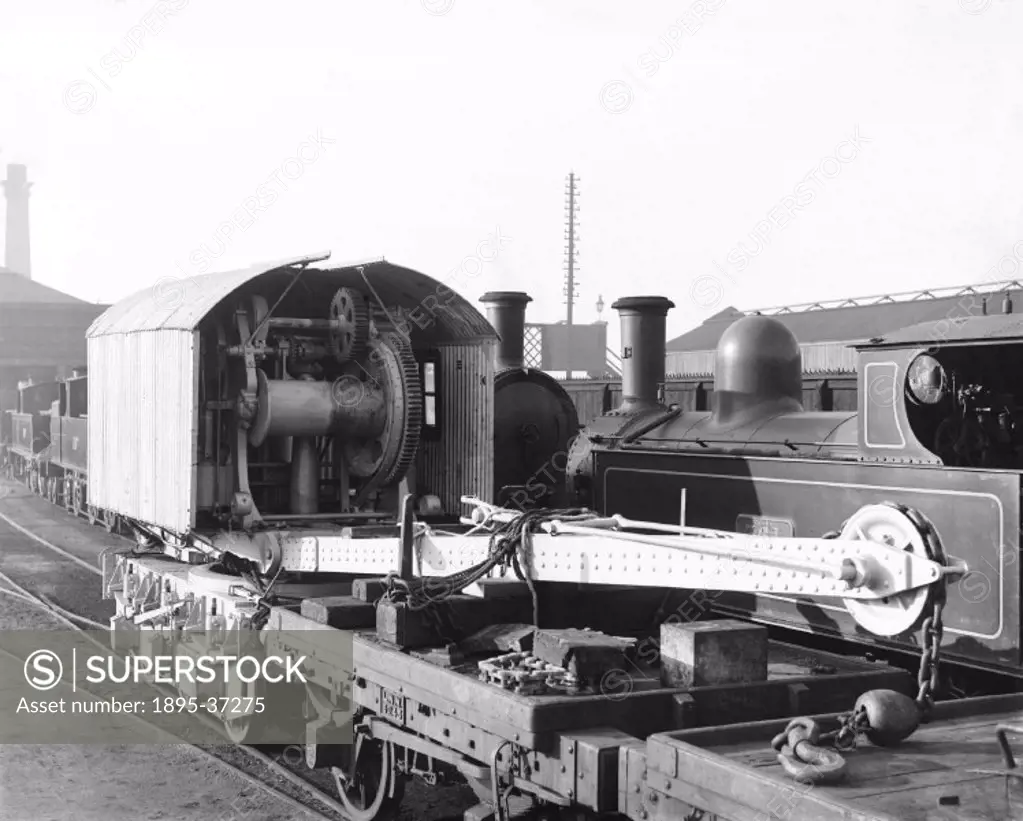 Seven ton mobile steam powered crane, about 1910.  Cranes are an invaluable machine in railway goods depots to lift heavy loads on and off wagons and ...