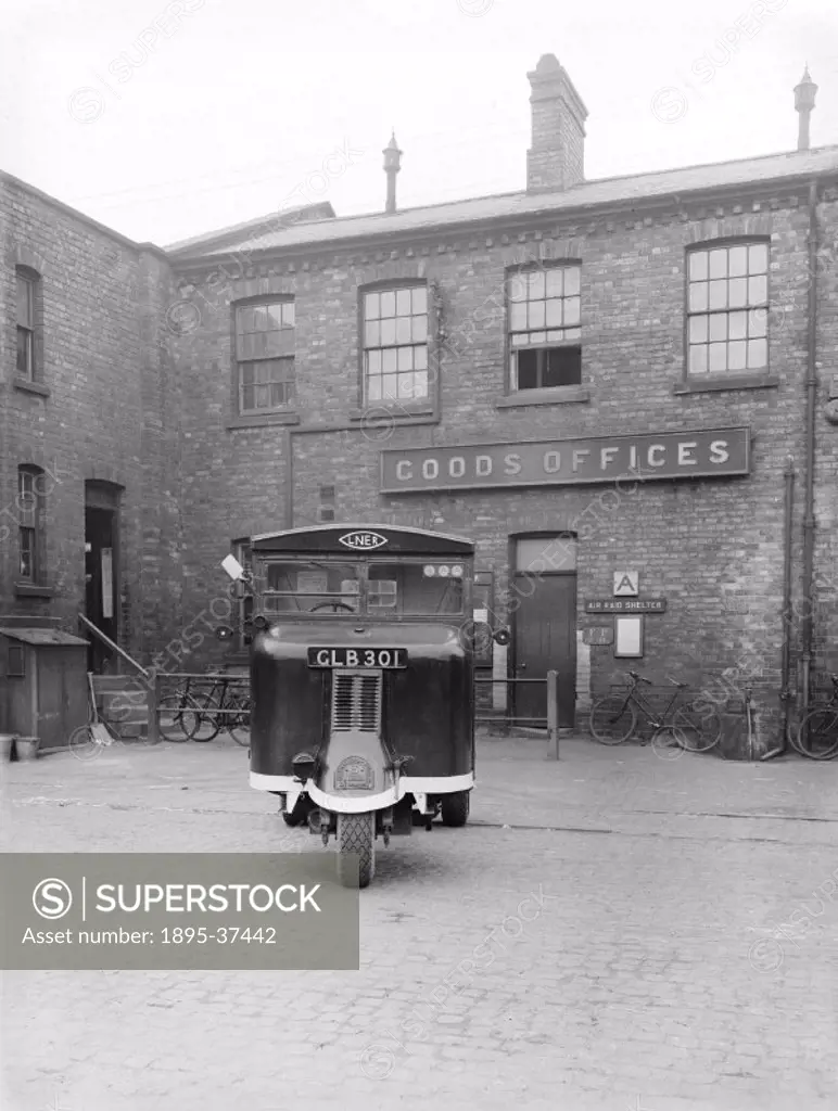 Scammell Mechanical horse outside a goods depot, 12 April 1943.  A mechanical horse was a machine on three wheels used to pull carts and drays, develo...