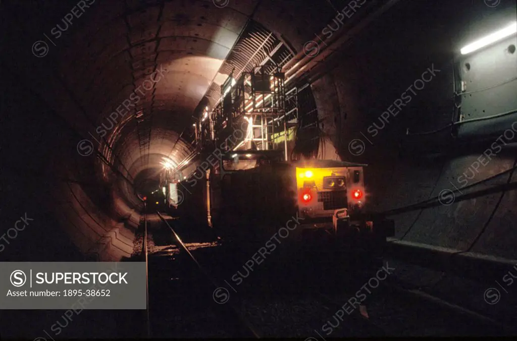 Train inside the Channel tunnel, during its construction, by Chris Hogg, 1992. During the construction of the tunnel, many trains ran in and out of th...