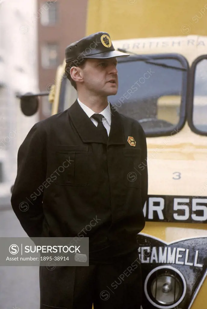 Railway lorry driver next to his Metro-Cammell lorry, April 1964.  Lorries were used by British Railways to collect and deliver freight that was to be...