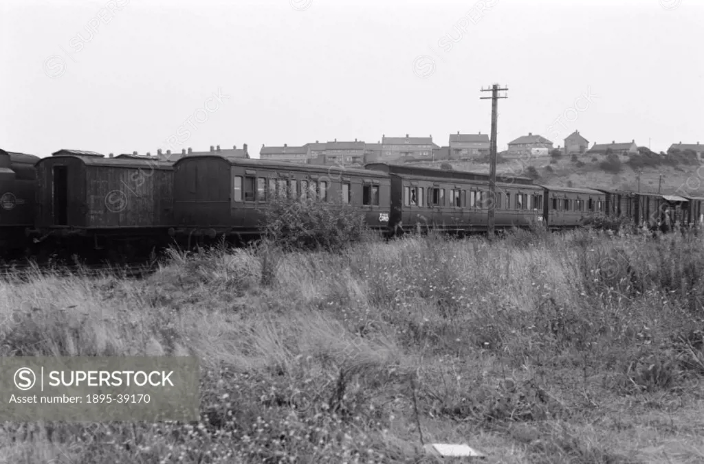 Scrapyard, for locomotives and rolling stock on the former Great Western Railway, by Selwyn Pearce-Higgins, 1966.  Scrap yards were filled with railwa...