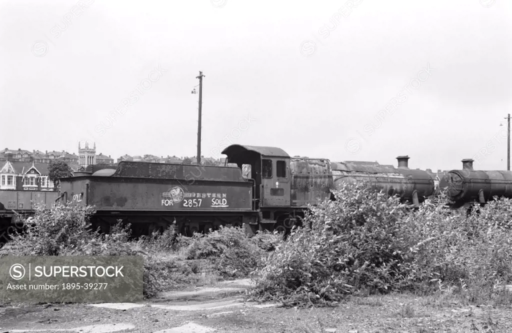 2800 class 2-8-0 locomotive number 2857 in a scrap yard, by Selwyn Pearce-Higgins, 1972. This locomotive is to be preserved.   Steam locomotives were ...