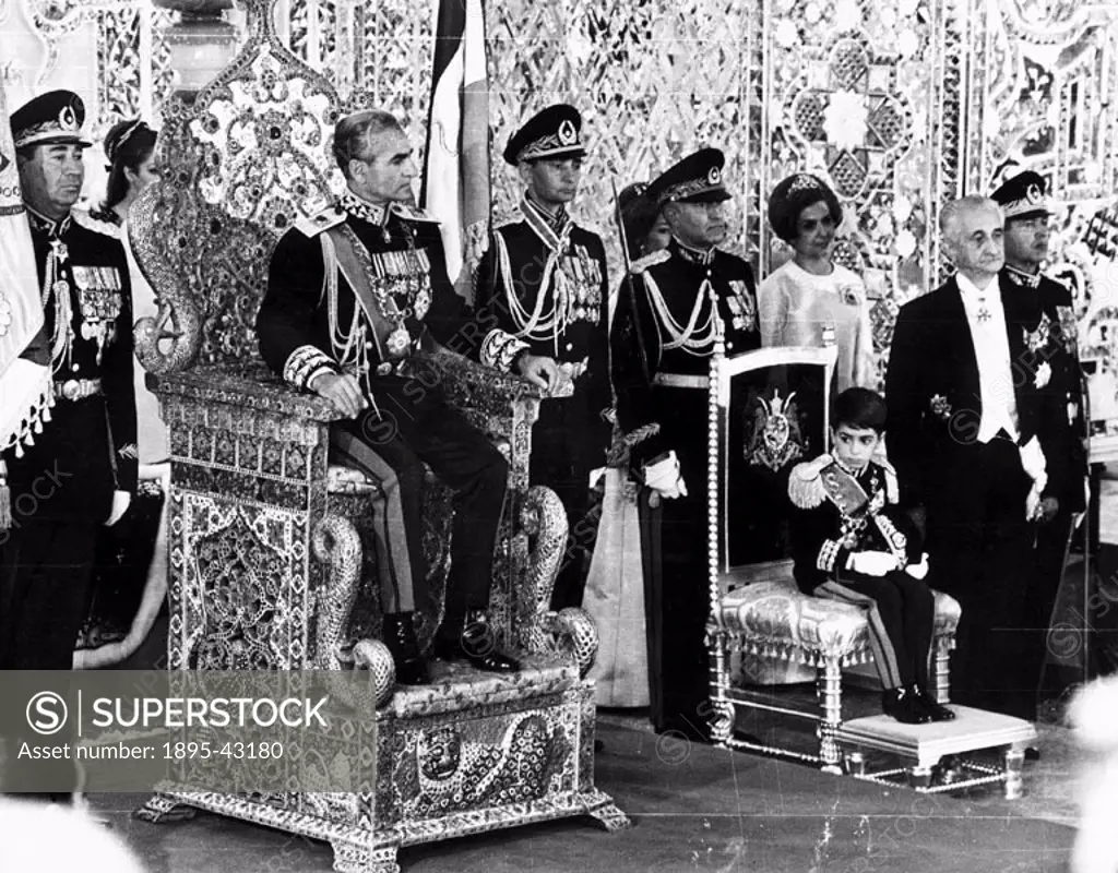 Seven-year-old Crown Prince Reza attends the coronation of his father the Shah, Muhammad Reza Pahlavi (1919-1980). In 1979 the Shah left the country, ...