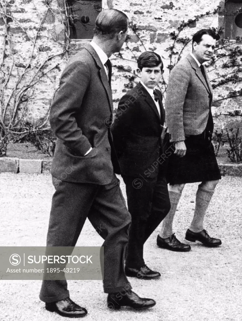 The Duke of Edinburgh walks with his son and Captain Iain Tennant in front of Gordonstoun, Prince Charles exclusive public school. Heir to the throne...