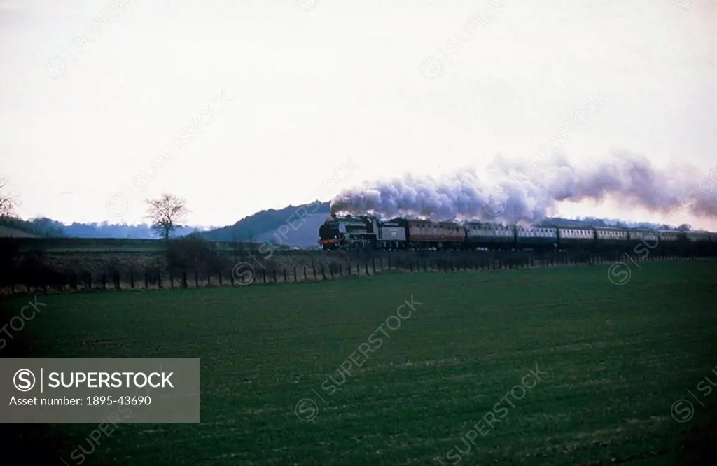 Steam locomotive pulling a passenger train