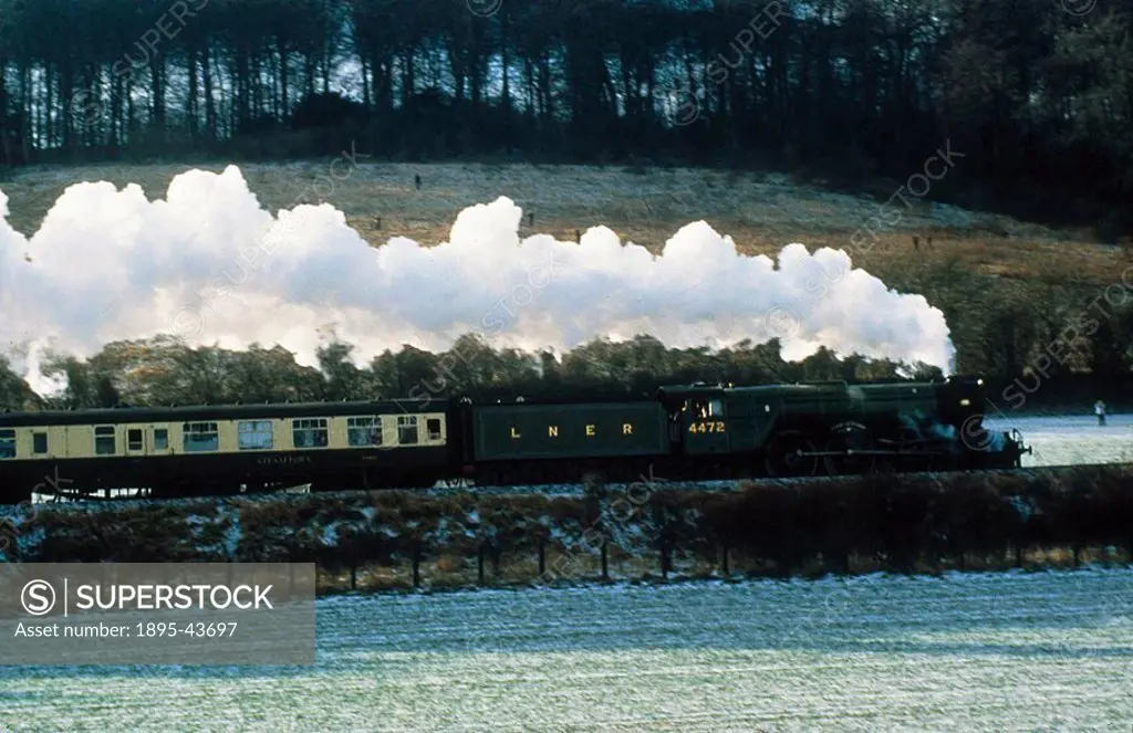 The Flying Scotsman’ steam locomotive pulling a passenger train  London & North Eastern Railway Flying Scotsman’ locomotive 4472, built in 1923