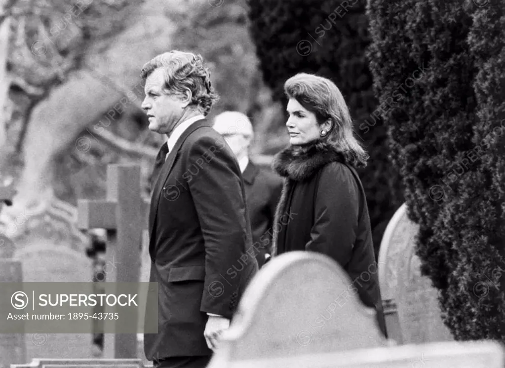 Americans Senator Edward Kennedy and his ex-sister-in-law Jaqueline Onassis at  the funeral of British politician Lord Harlech (1918-1985) who played ...