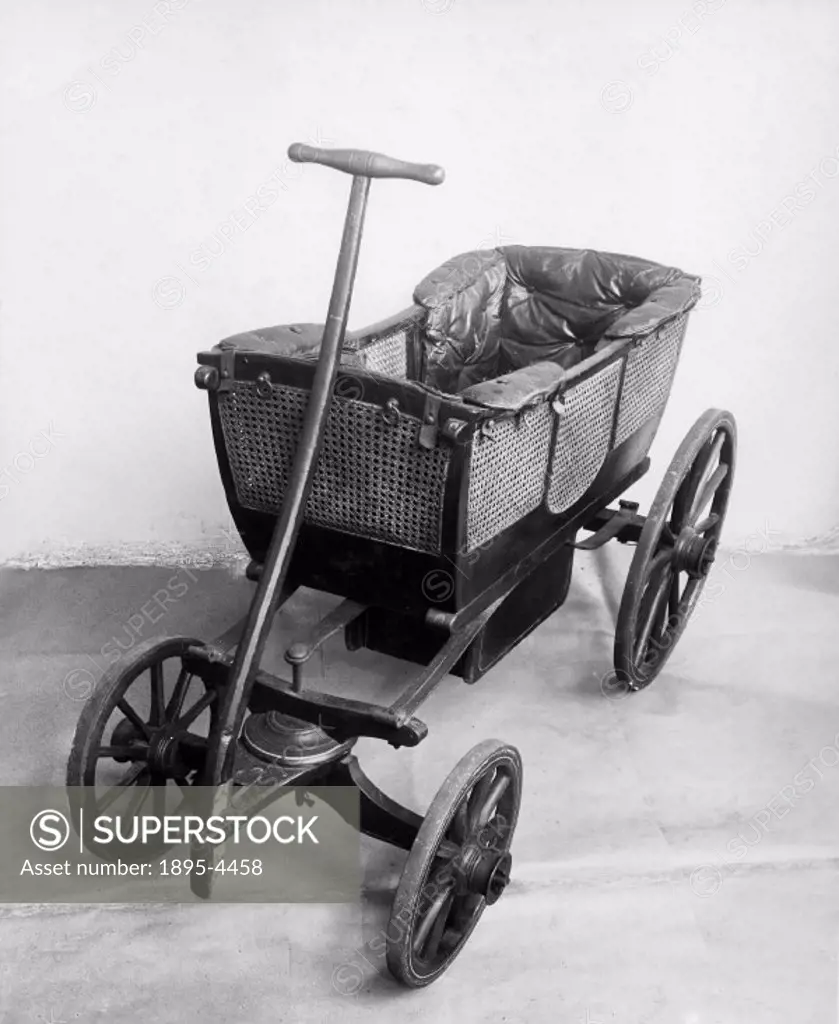 Child´s carriage with iron shod wheels, and lattice work sides.