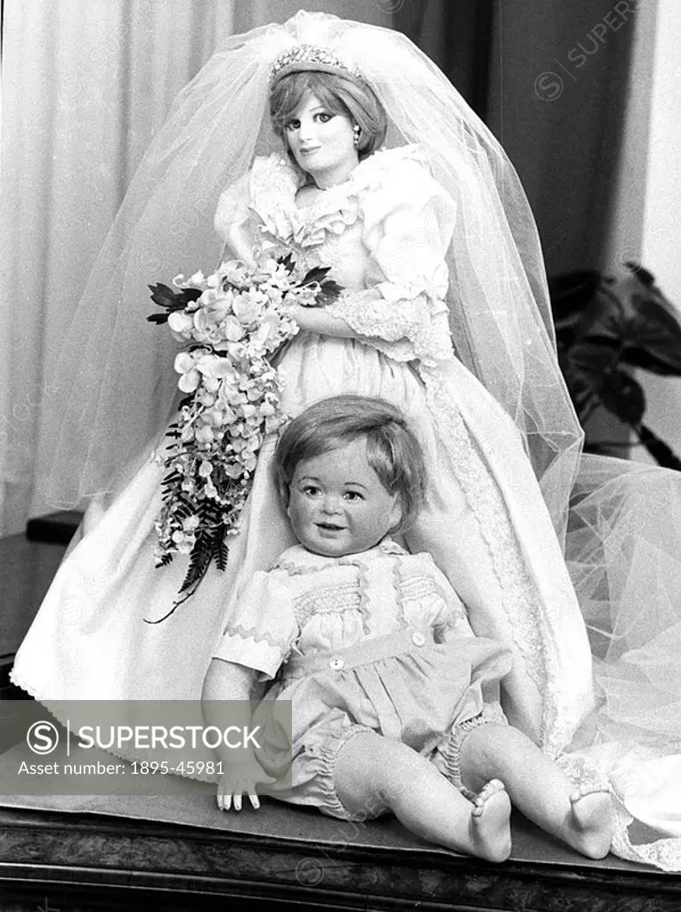 Diana, Princess of Wales in her wedding dress, and her son William as a baby, in doll form