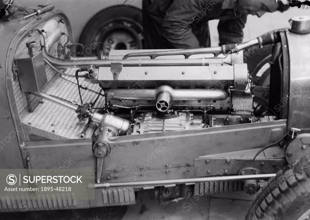 Mechanic working on a Bugatti racing car, Nurburgring, Germany, 1932.Photograph by Zoltan Glass. Side close_up of a Bugatti Type 51 with Straight 8 su...