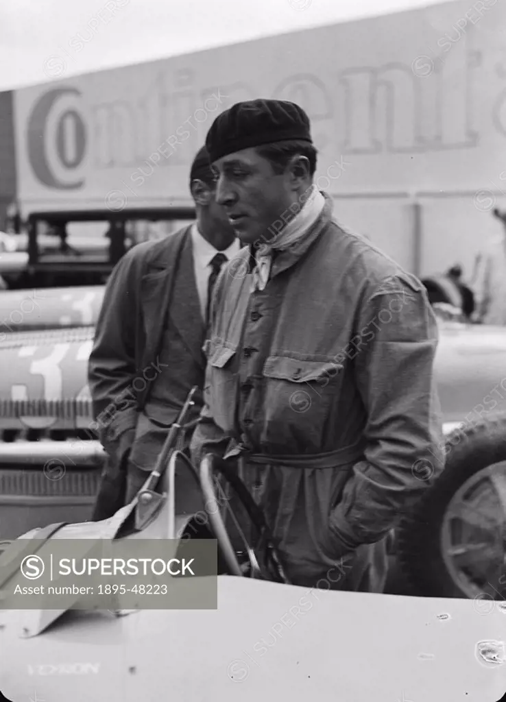 Pierre Veyron stands beside a Bugatti Type 54 racing car, Berlin, 1933.Photograph by Zoltan Glass. French Grand Prix motor racing driver Veyron won th...