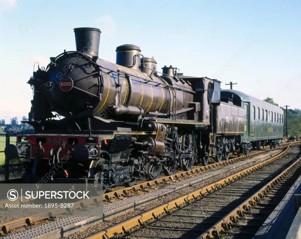 Nord 4-6-0 compound locomotive, no 3628 and carriage, 1911, on bridge, (Nene Valley Railway), 3/4 view.