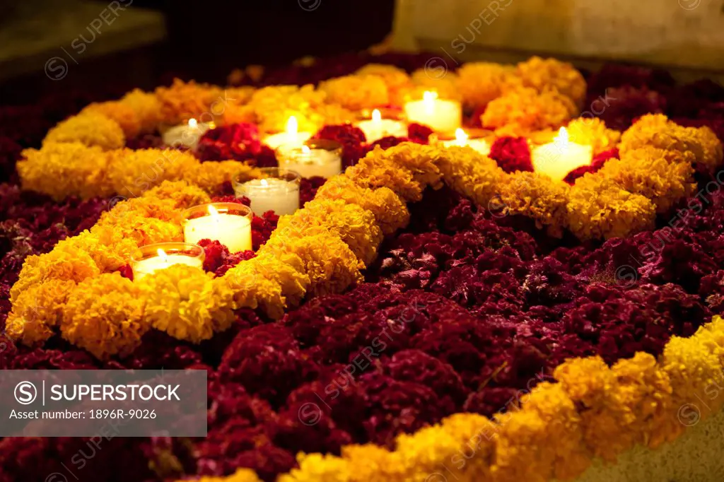 Grave adorned with marigold flowers during Day of the Dead Dias de los Muertos celebration in November, Pantheon San Miguel Cemetery, Oaxaca, Mexico