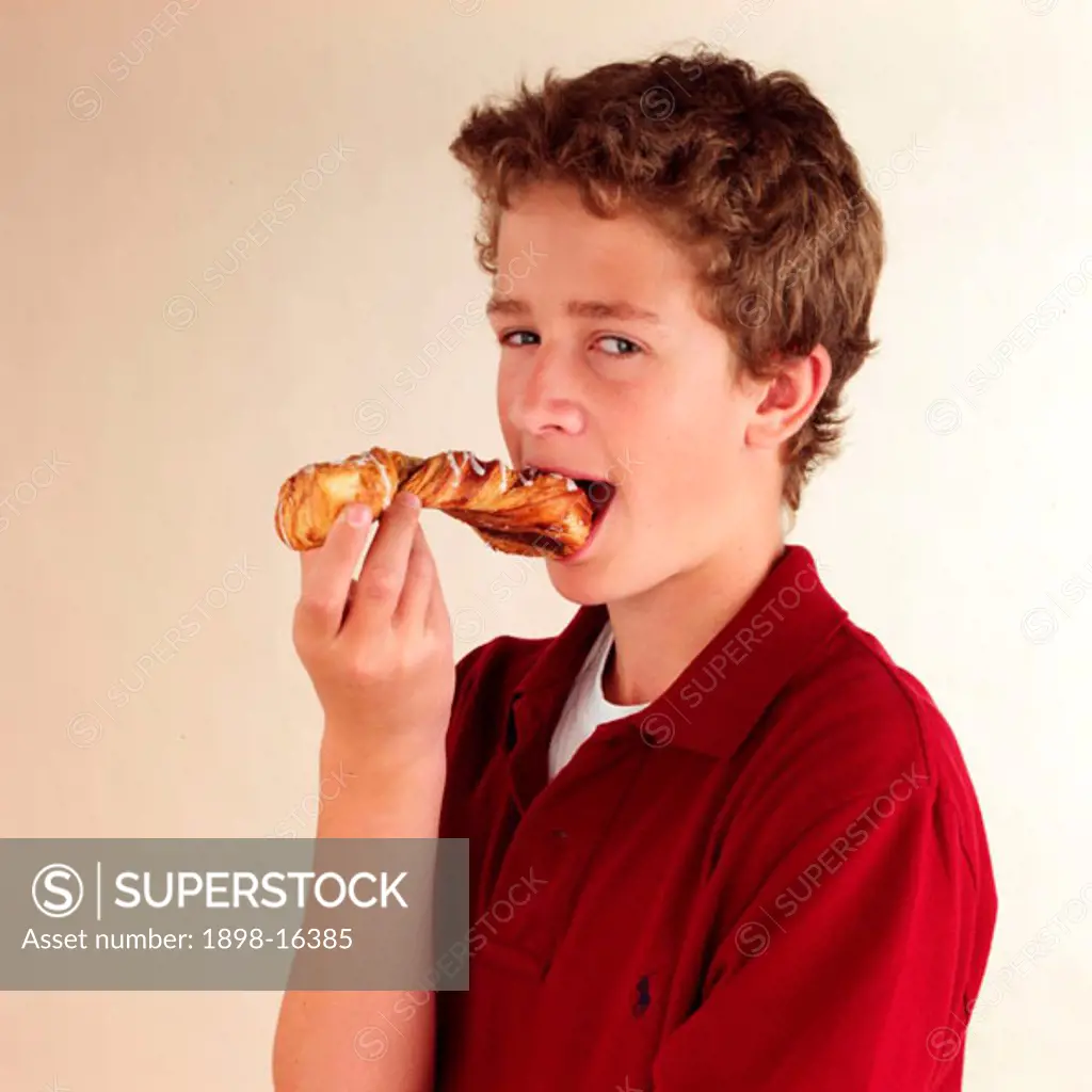 Child eating croissant