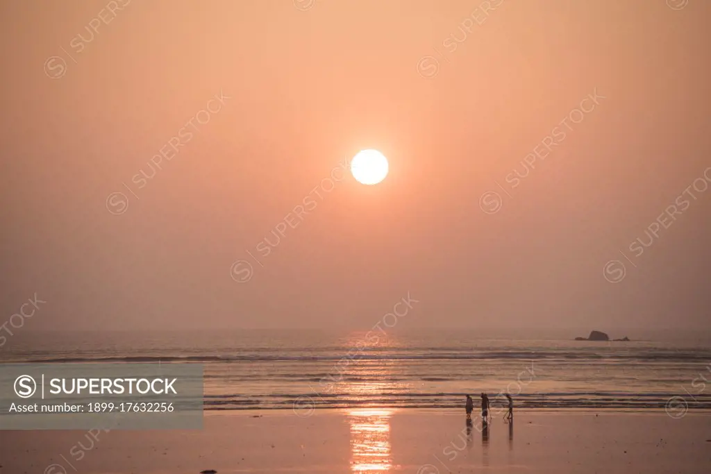 People on Maungmagan Beach at sunset, Dawei, Tanintharyi Region, Myanmar (Burma)