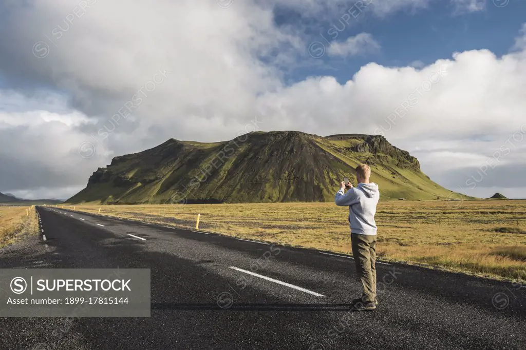 Tourist taking a photo from route 1 near Vik, South Region, Sudurland, Europe