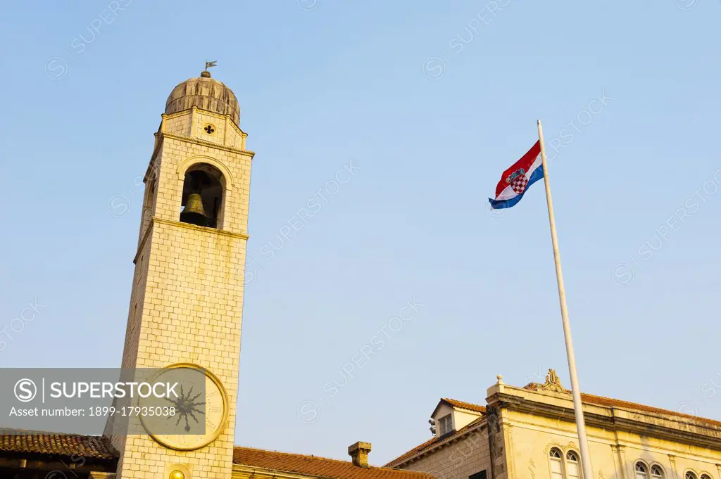 Photo of Dubrovnik City Bell Tower and the Croatian flag, Dubrovnik, Dalmatia, Croatia