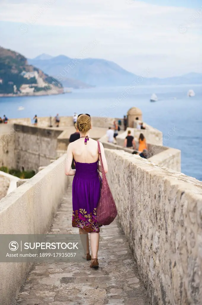 Photo of a tourist on Dubrovnik City Walls, Dubrovnik Old Town, Croatia