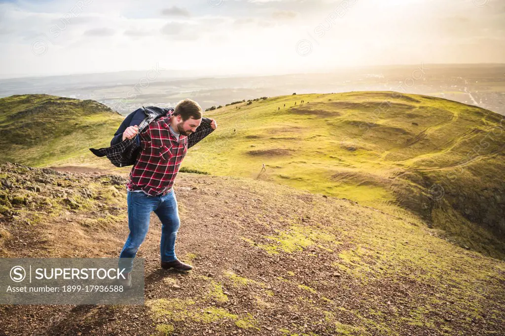 Being blown around by the wind on Arthur's Seat, Edinburgh, Scotland, United Kingdom, Europe