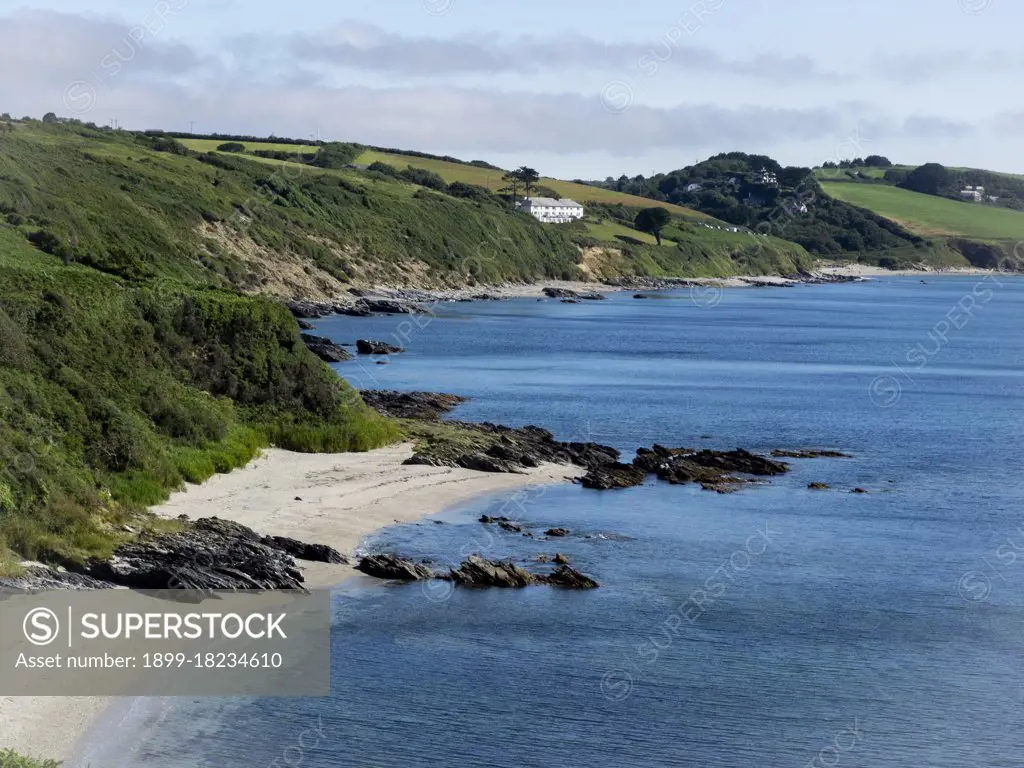 View over Gerrans Bay from Pendower beach to Carne Beach, The Roseland Peninsula, Cornwall, UK. (Photo by: Nik Taylor/UIG)