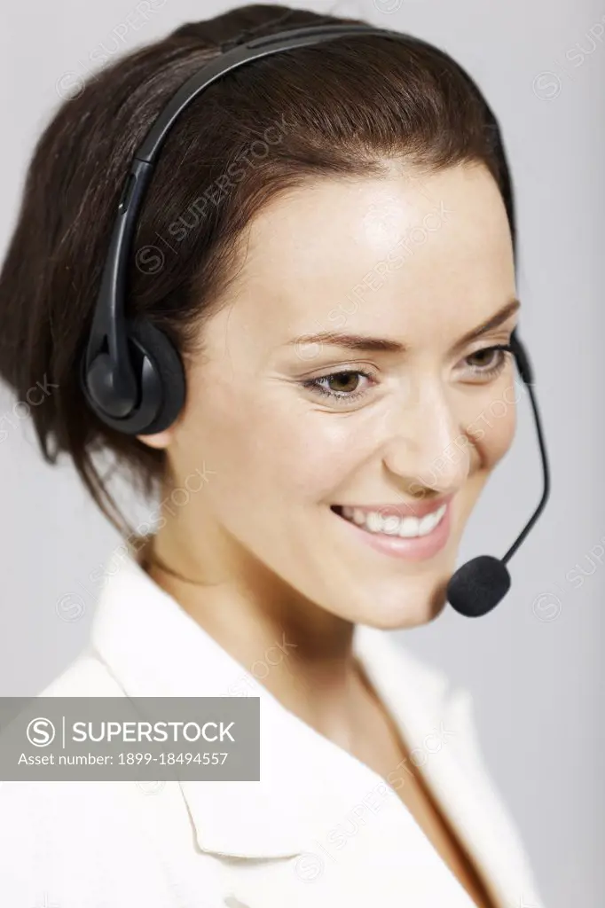 Happy call center lady with telephone headset