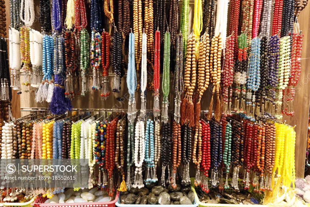 Muslim prayer beads ( tesbih ) in different patterns and colors.  Dubai. United Arab Emirates.