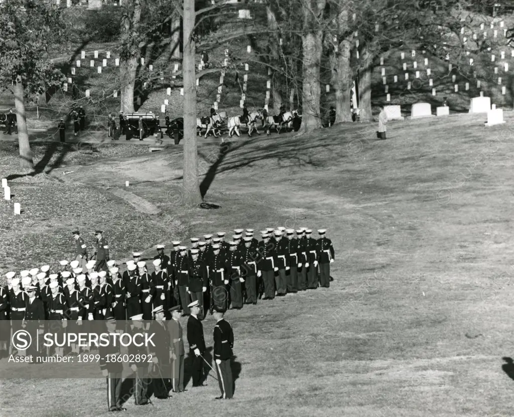 The horse-drawn caisson bearing the body of slain President John F. Kennedy approaches the burial site at Arlington National Cemetery. November 25, 1963. Abbie Rowe photographer.