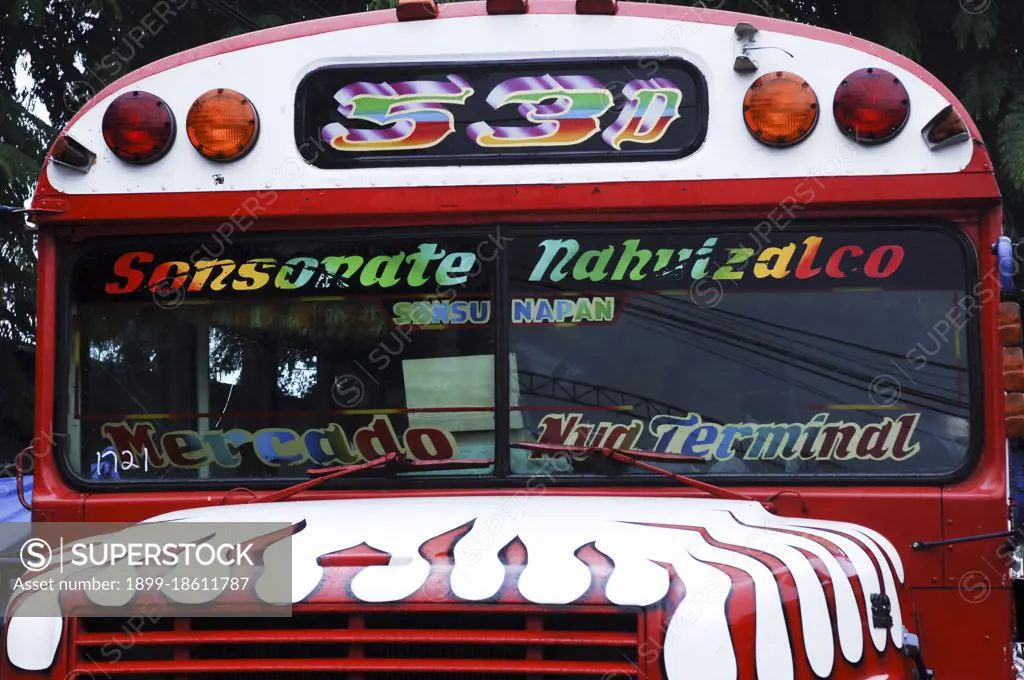 School bus repainted and used as a public bus at the night market in Nahuizalco. El Salvador. Central America.